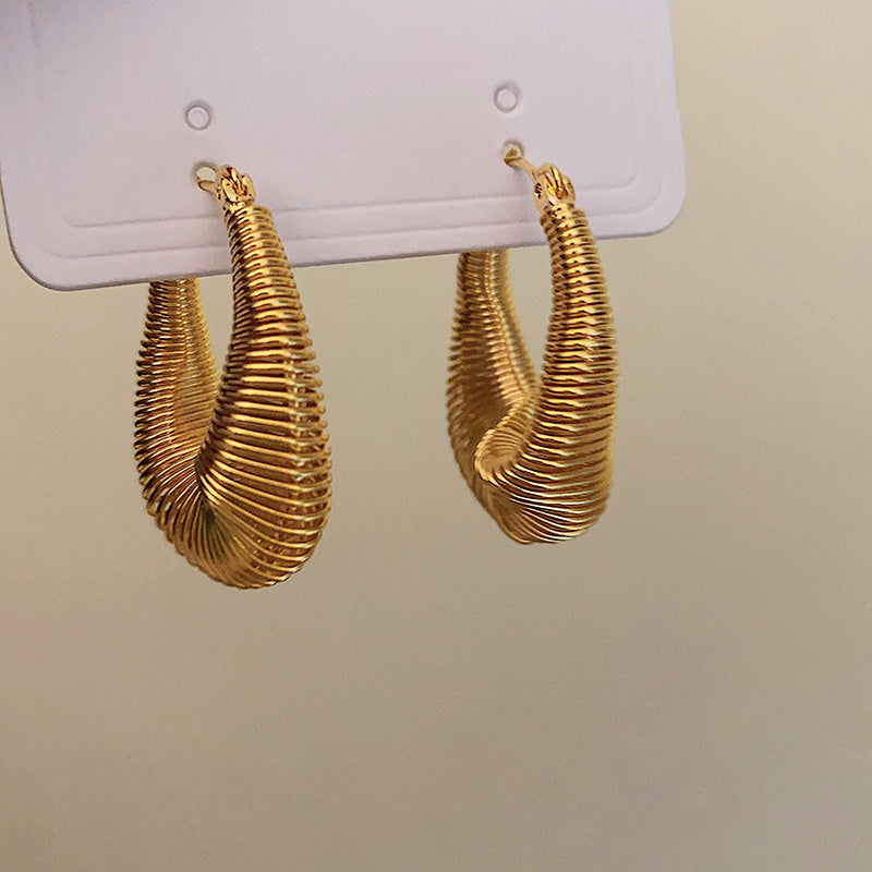 Elegant gold dainty hoop earrings USA featuring a unique twisted design for stylish accessorizing