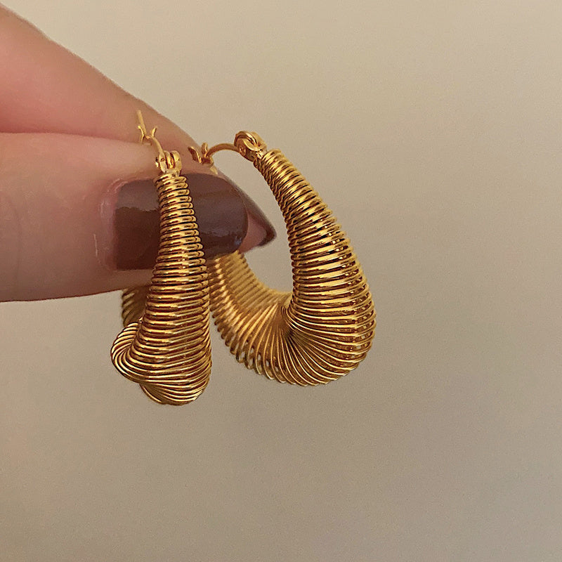Gold statement dainty hoop earrings USA in a unique twisted design, perfect for everyday wear