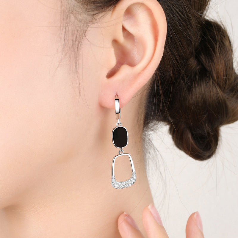 Hollow out diamond earrings with sleek design featuring a black and silver color combination