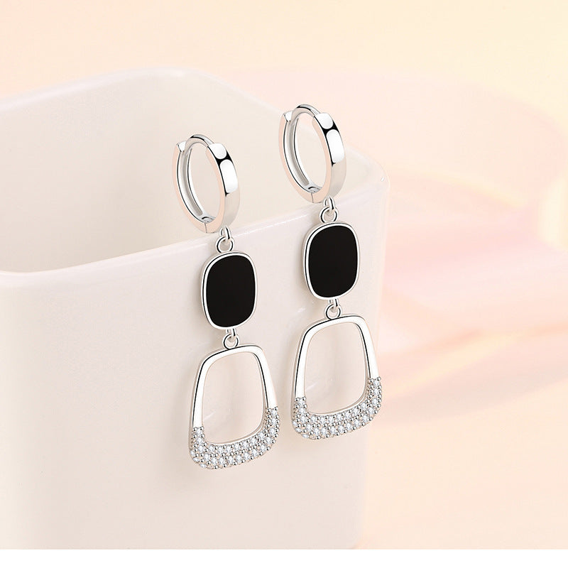 Statement hollow out diamond earrings with black accents and sparkling detail for elegant style