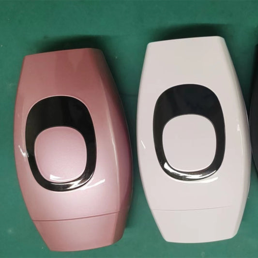 Smooth Beam LCD hair removal device in pink and white colors with oval black control panels