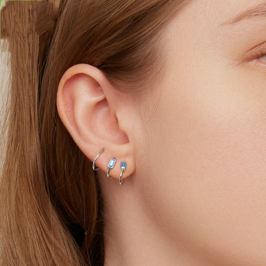 Stylish personalized zircon earrings showcased on model's ear, perfect for everyday wear