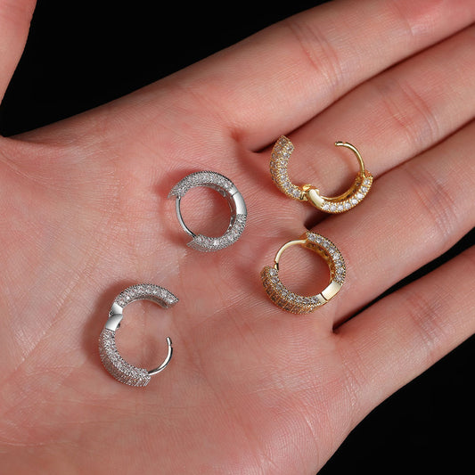 Elegant pop hoop earrings USA in silver and gold featuring a textured design on a hand