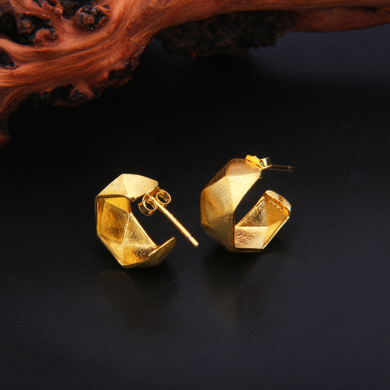 Stylish geometric gold hoops from Statement Earrings for a modern look