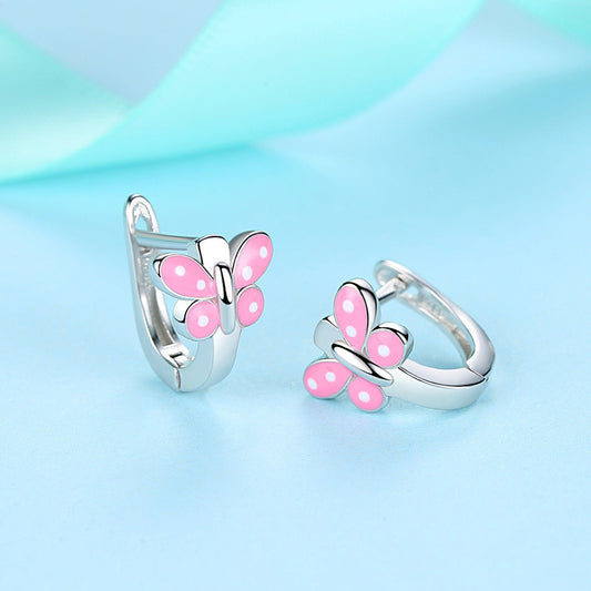 Sterling silver butterfly earrings with pink enamel accents, perfect for adding a playful touch to any outfit