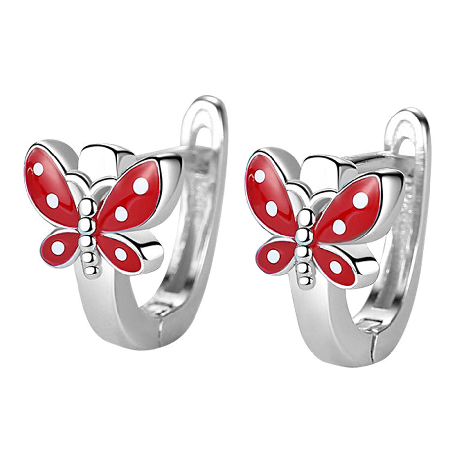 Sterling silver butterfly earrings with red and white enamel detailing for a playful look