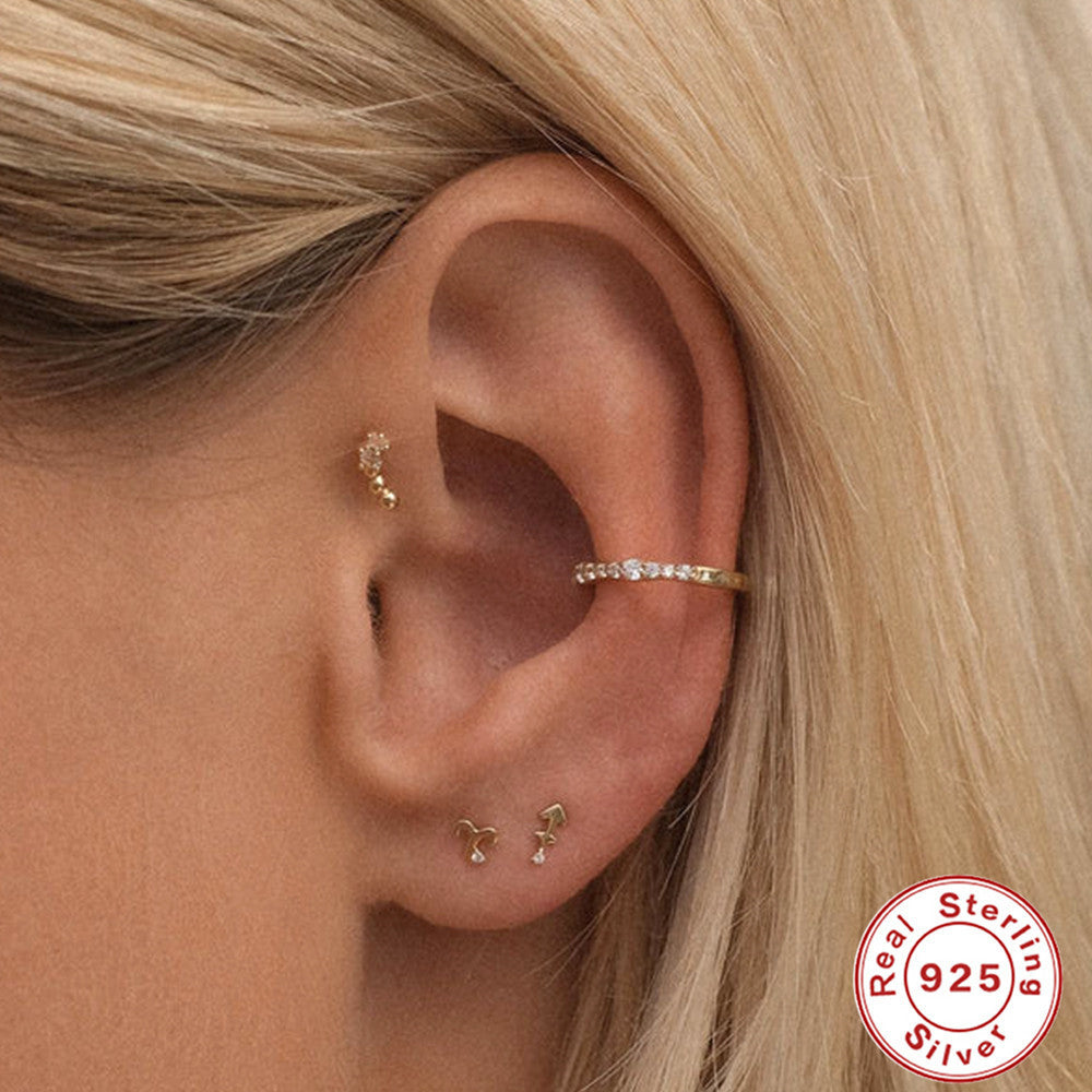 Close-up of a model wearing Sterling Silver Constellation Earrings showcasing elegant design and shine