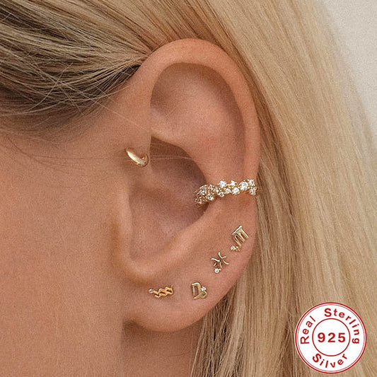 Fashionable Sterling Silver Constellation Earrings displayed on a model's ear with contemporary style